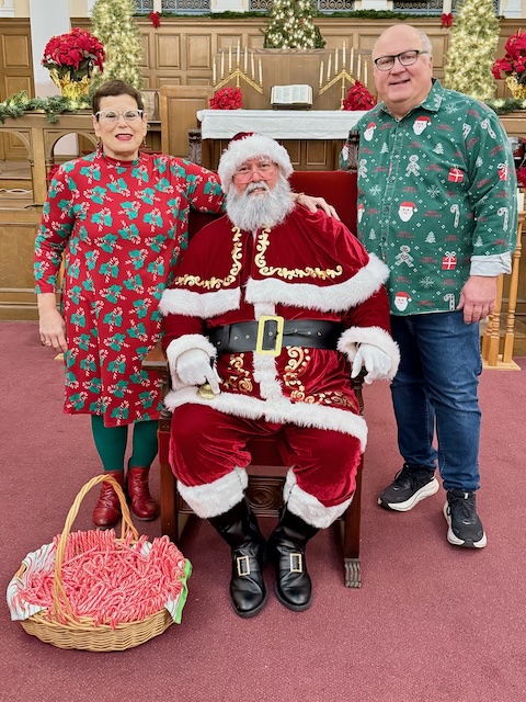 Mary Joy and Bill with Santa at Christmas in the Village 2025
